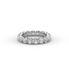 Diamond eternity ring with pavé-set diamonds around a silver band on a black background