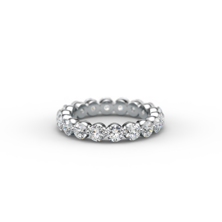Diamond eternity ring with pavé-set diamonds around a silver band on a black background